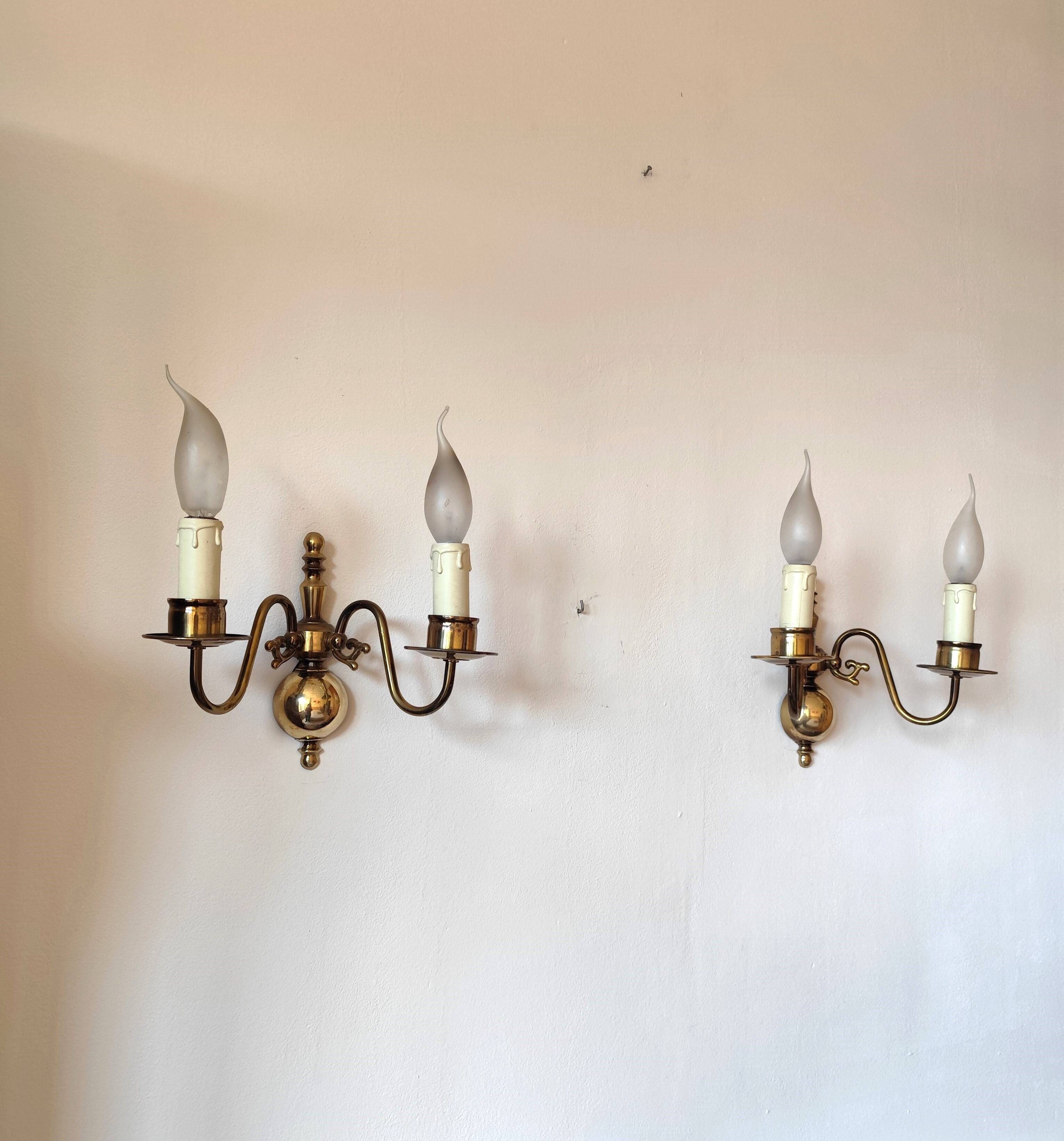 Pair of Dutch style 2-light brass wall lights
