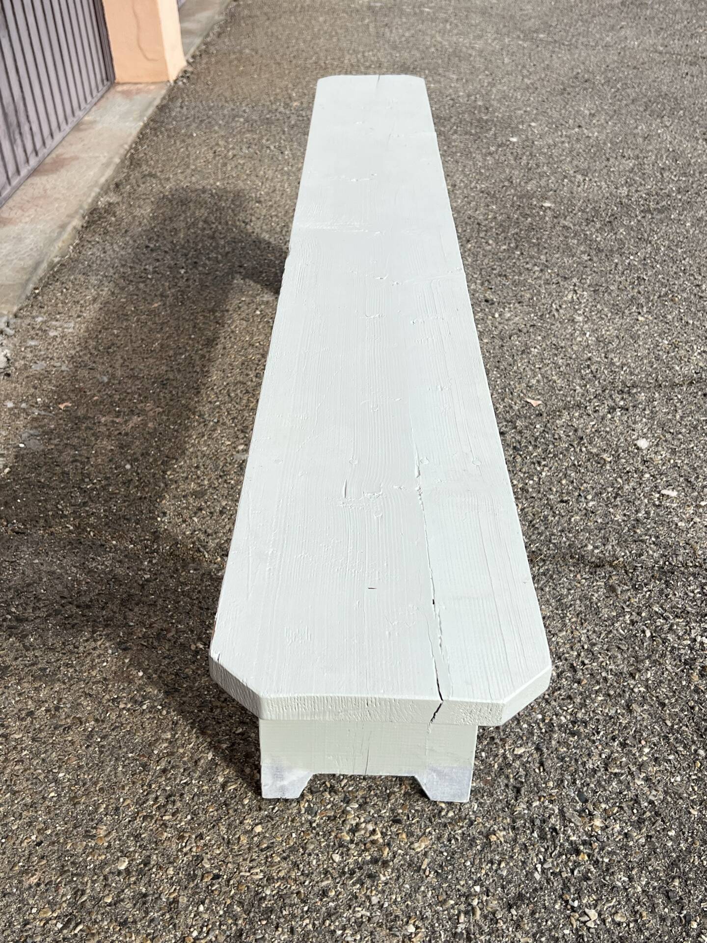 Pair of wooden benches painted white, French artisanal work.