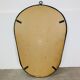 Oval mirror from the 1950s, wrought iron and brass.