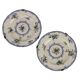 Antique earthenware plates with floral decoration from the 19th century.