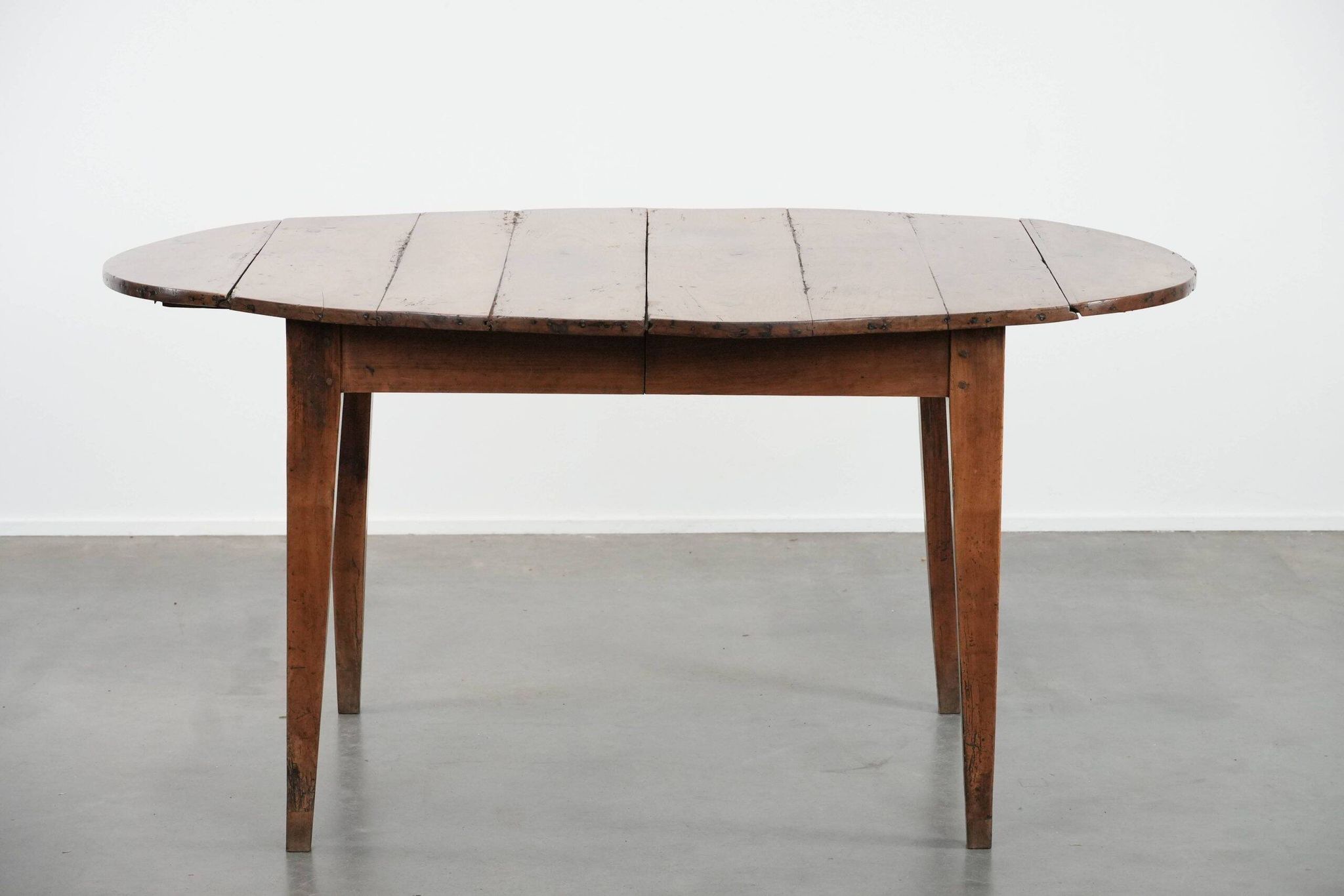 Rare antique oval French extendable dining table made of fruitwood