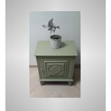Bedside table with floral sculptures