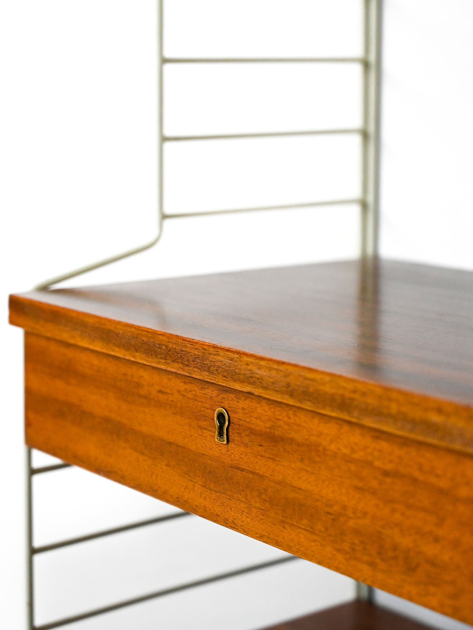 'string' bookcase with metal frame