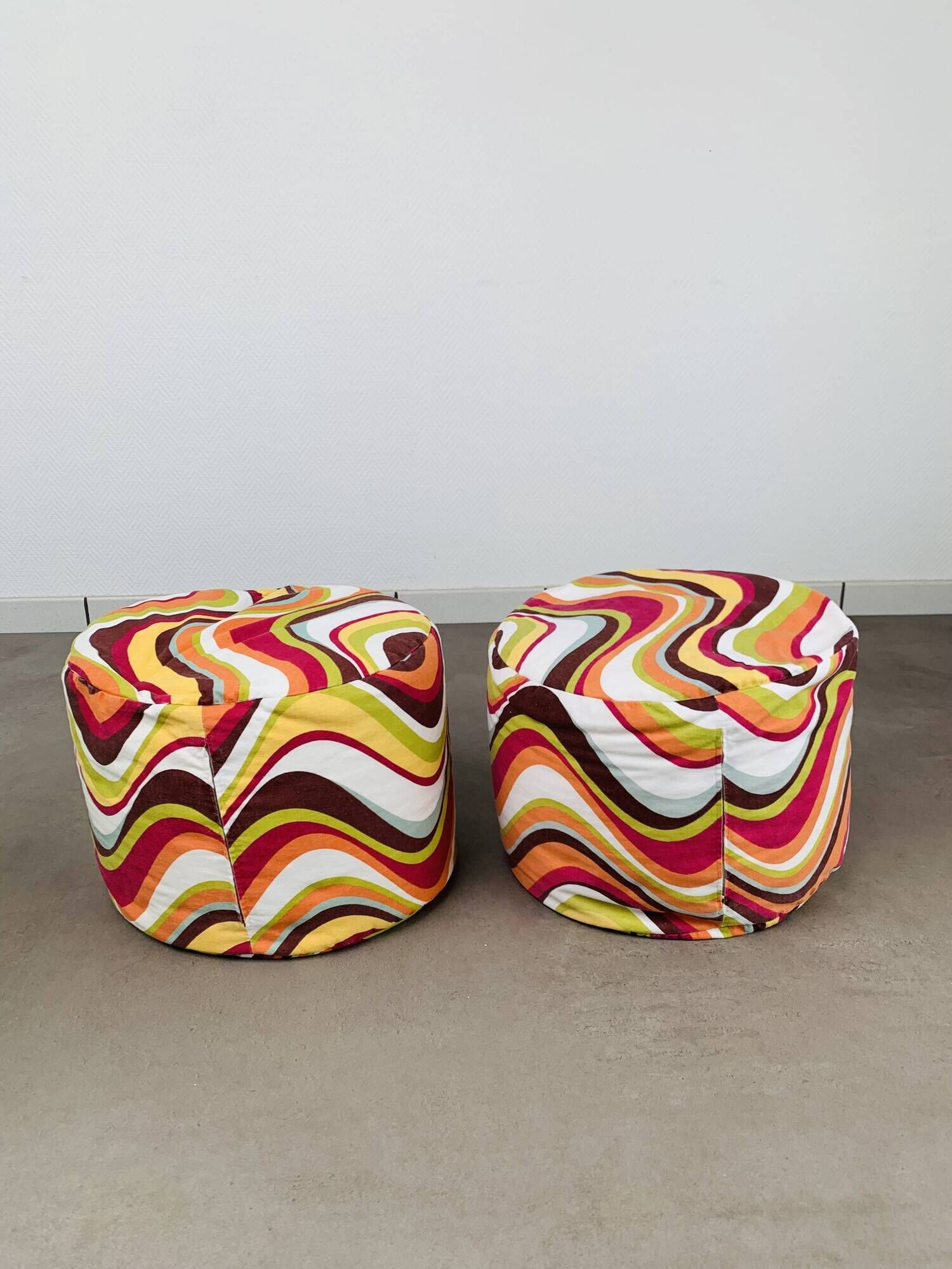Pair of "psychedelic" fabric poufs from the 70s.