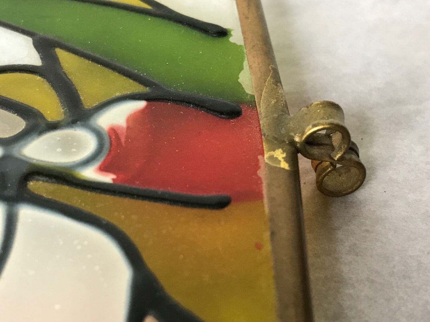 Glass box and hexagonal brass enamelled floral decoration