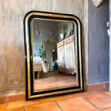 Louis-Philippe black and gold antique mirror from the 19th century