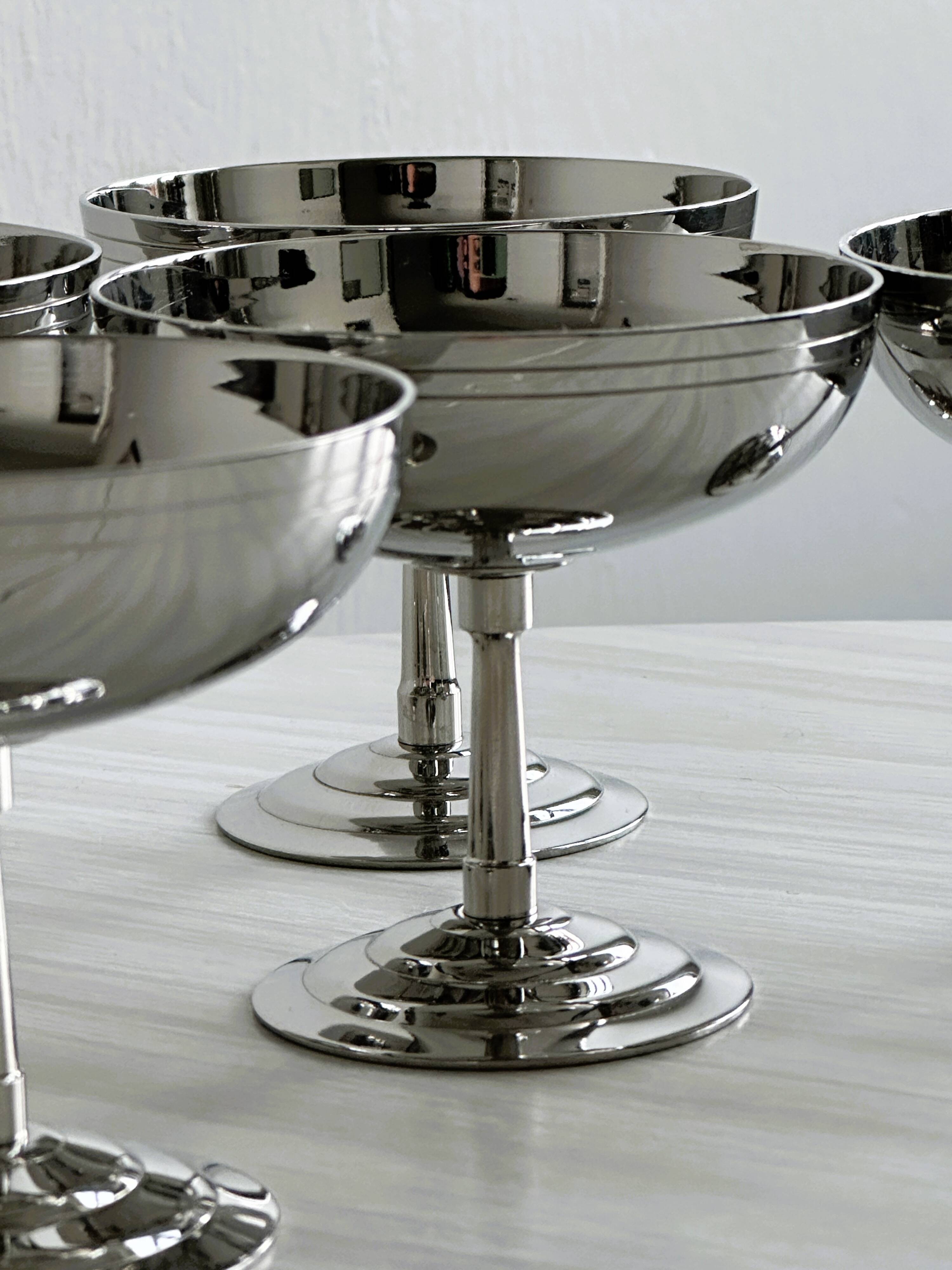 6 stainless steel standing cups, Letang Remy, France.