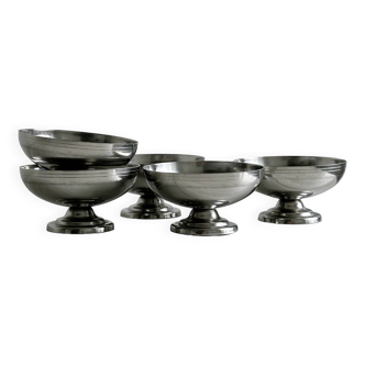 5 silver metal cups.