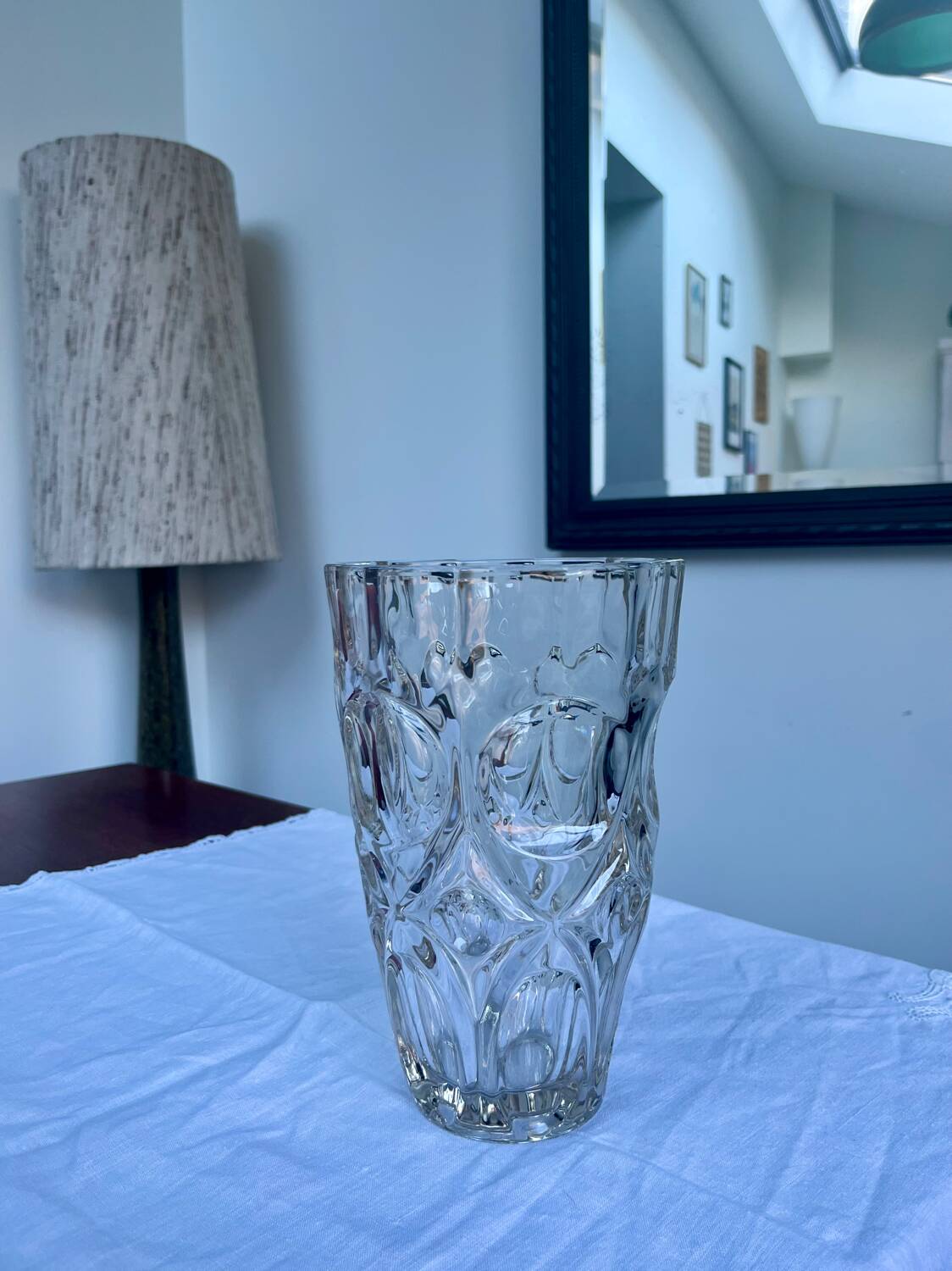 Molded glass vase with sculpted decoration