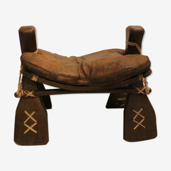 Camel saddle-shaped stool.