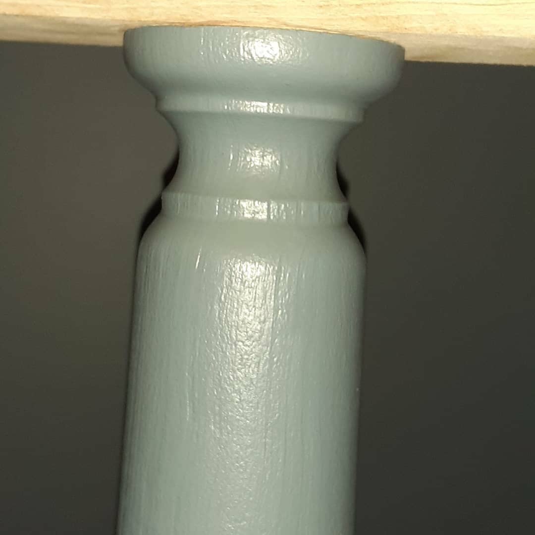 Gray and natural pedestal table