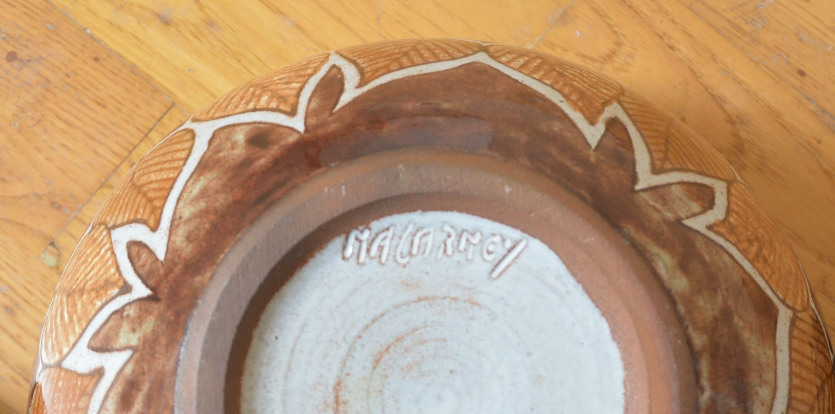 Cup with stylized leaf decoration by Jean-Claude Malarmey