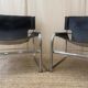 Black leather armchairs with a metal frame by Rodney Kinsman.