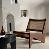 Reclined armchair in canned teak in natural wood