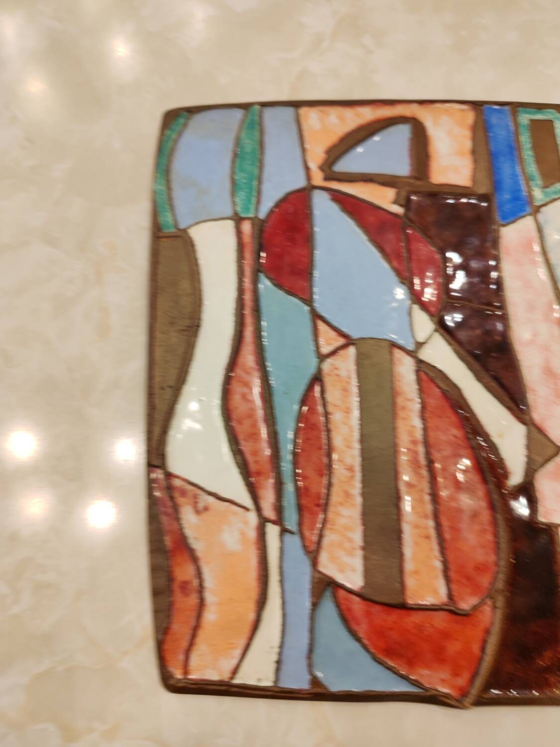 Isaac Lane Muse, brass and enamel plaque.