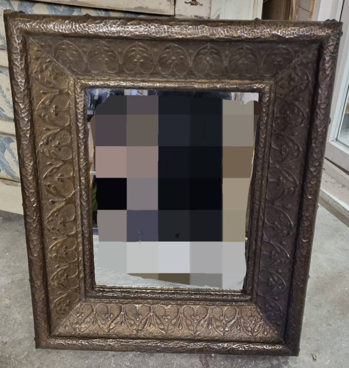 Early 20th century mirror made of stamped sheet metal