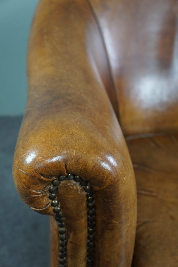 Club chair in patinated sheepskin
