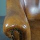 Club chair in patinated sheepskin