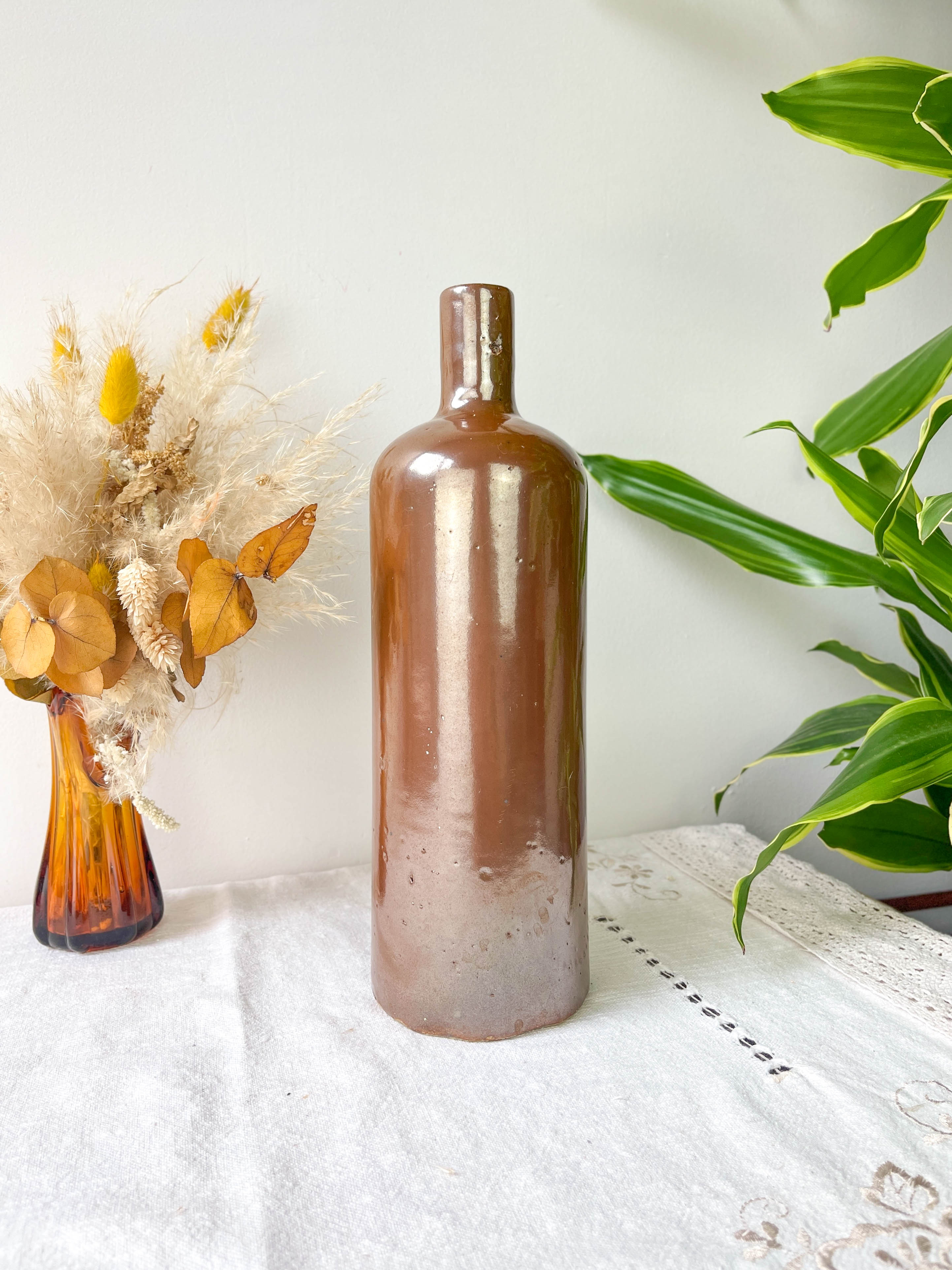 Vintage iridescent brown stoneware bottle