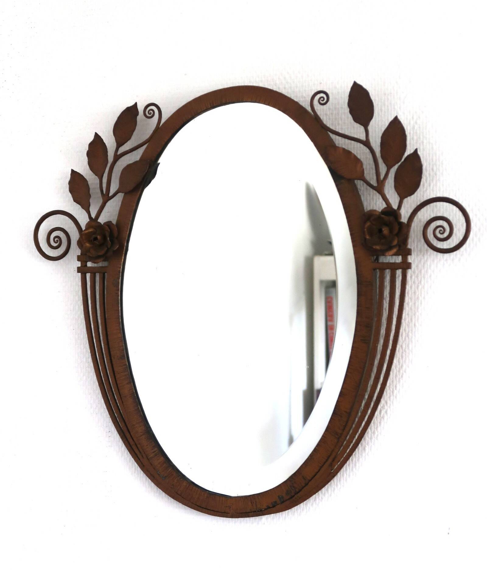 Art Deco mirror from the 1930s in hammered steel.