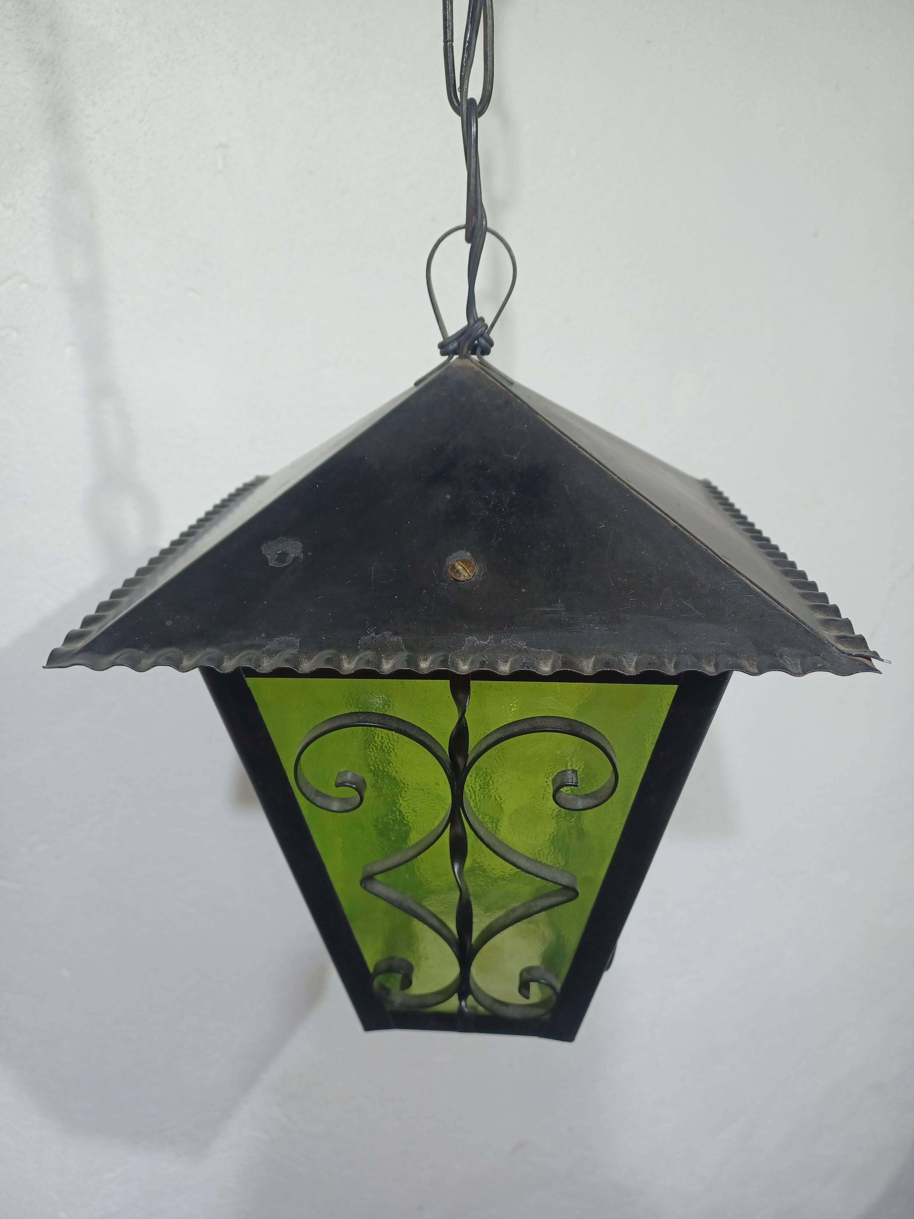 Wrought iron and green glass lantern