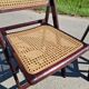 Set of 2 folding chairs in wood and cane.