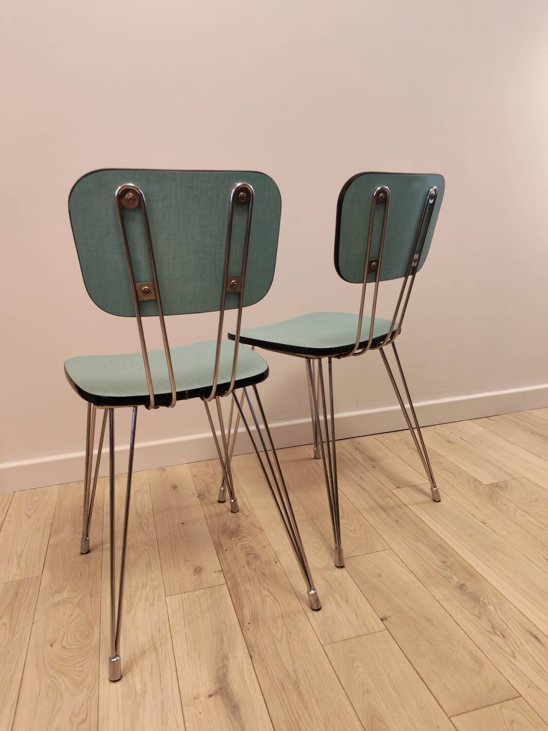 Pair of green Formica chairs with Eiffel legs