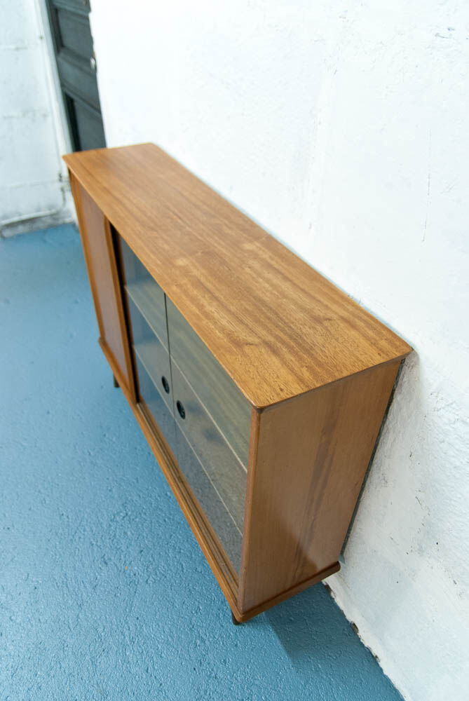 Console with sliding doors
