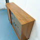 Console with sliding doors
