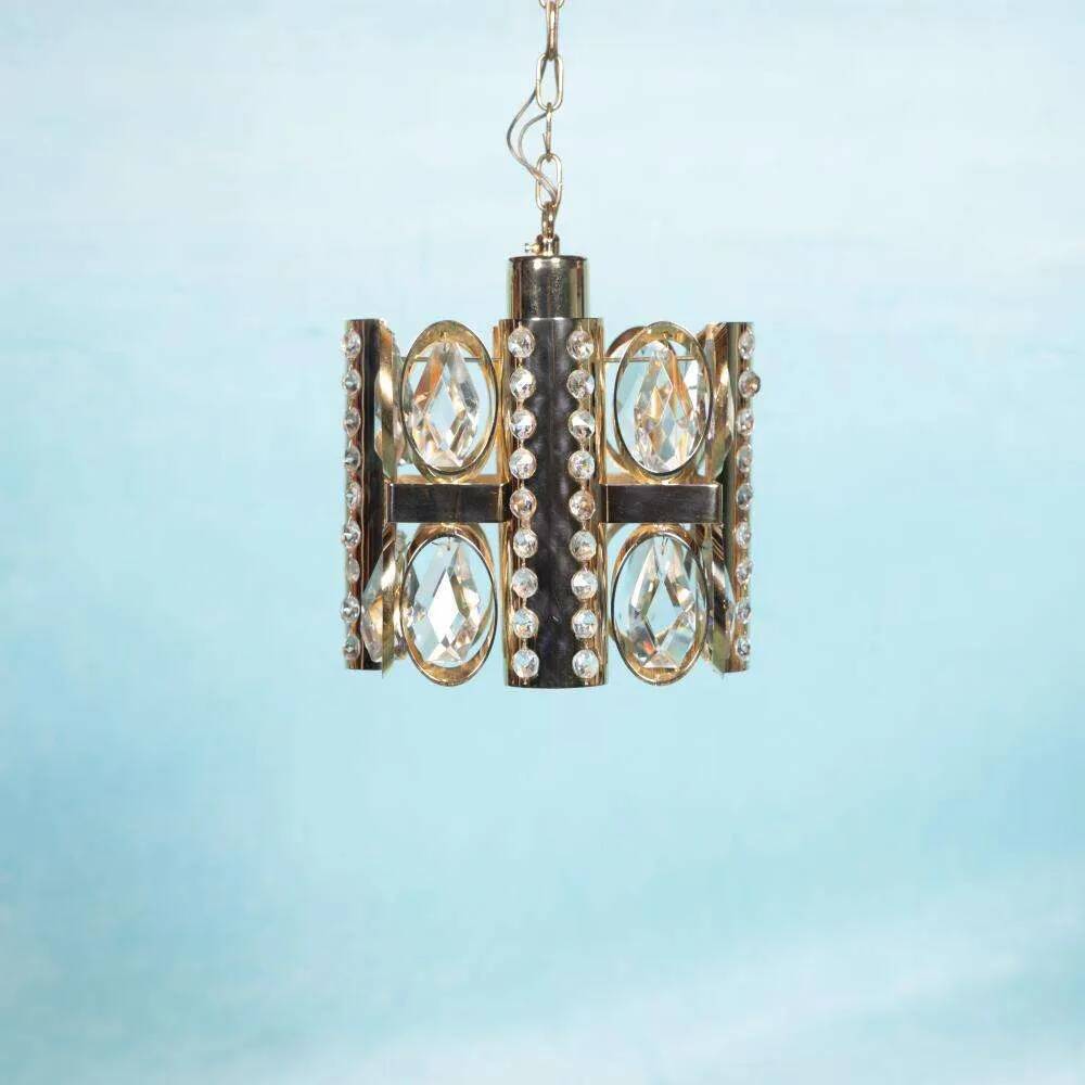 Palwa mid-century suspended chandelier in crystal, glass and brass.