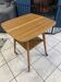 Scandinavian vintage 50s wooden side table with a swivel top.