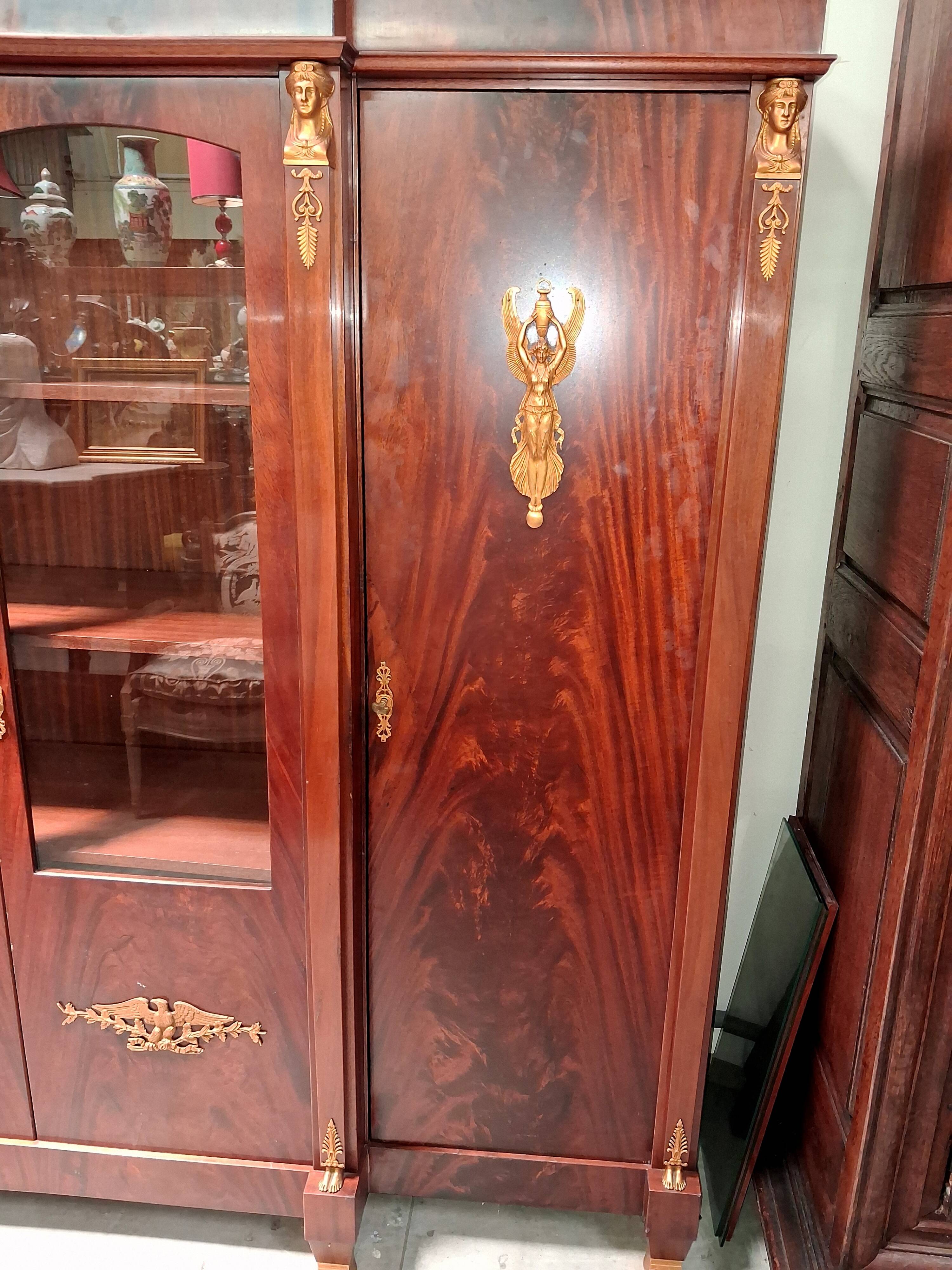 Empire-style library in flame mahogany – Gilded bronzes –
