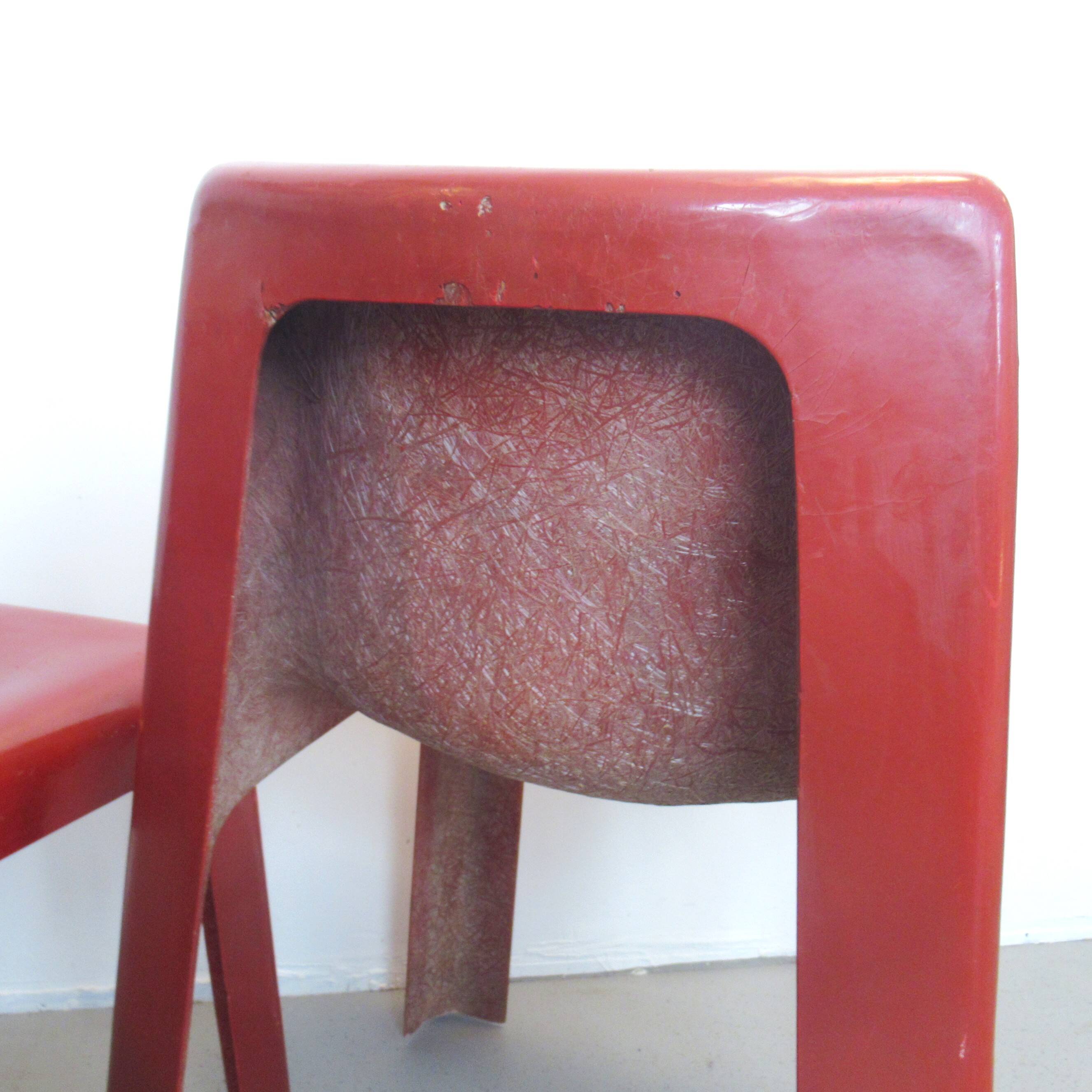 Pair of red fibreglass chairs from the 1970s.