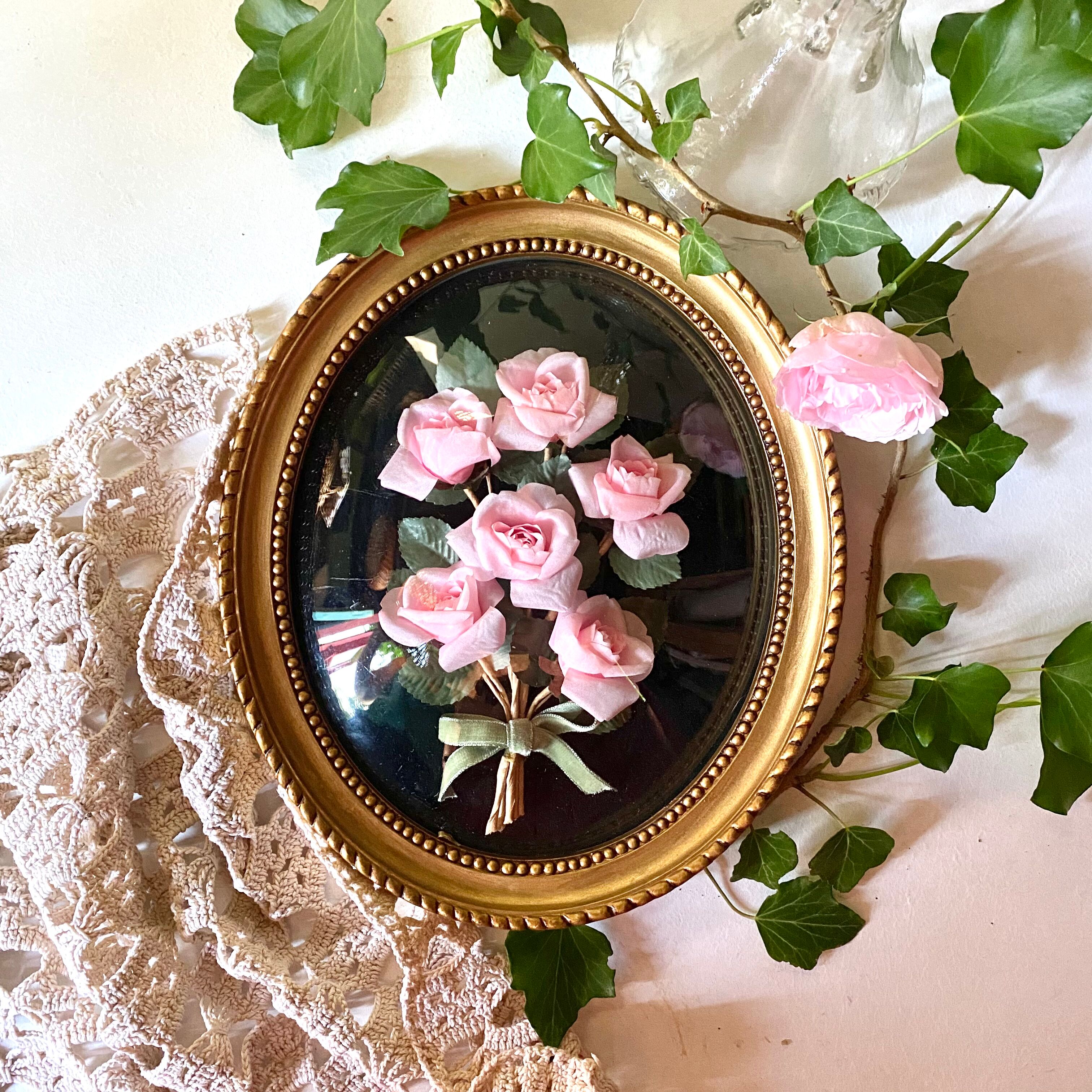 Oval frame domed glass curved roses