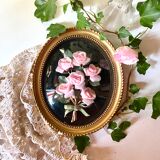 Oval frame domed glass curved roses