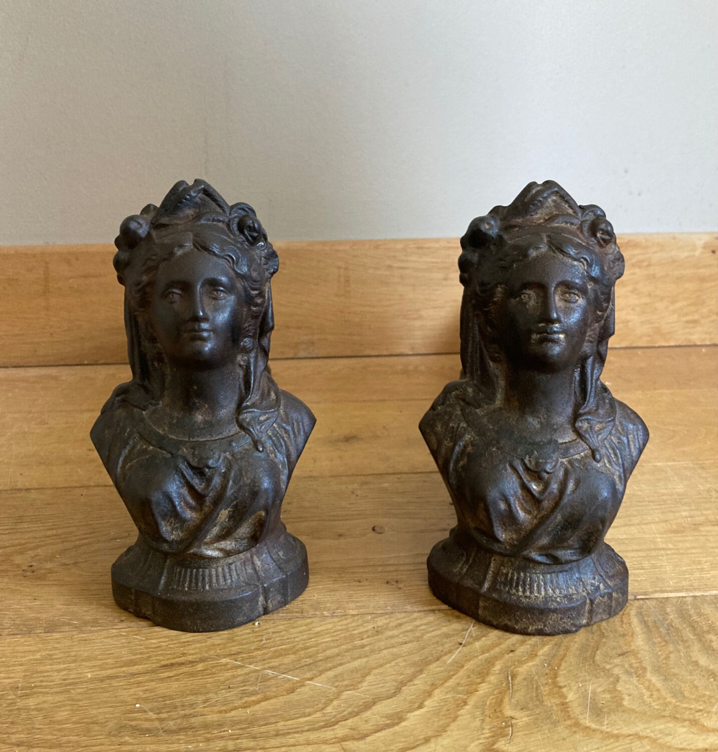 Pair of cast iron andirons from the 19th century, busts of women