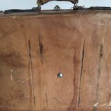 suitcase of leather with labels of palaces