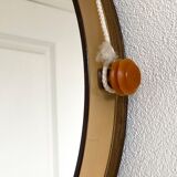 Space age round mirror with a smoked acrylic border