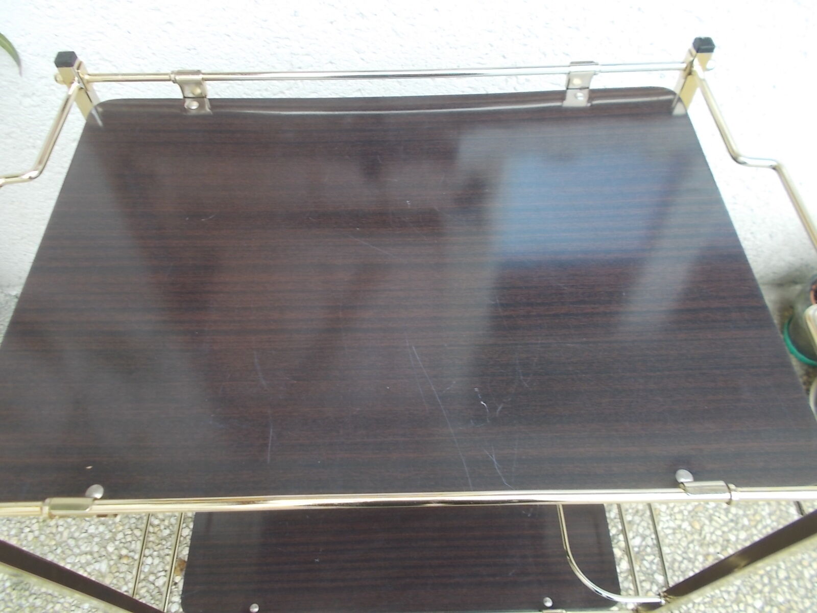 Rolling serving table in brass