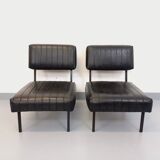 Set of 2 vintage modernist armchairs in black faux leather and metal.
