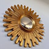 Old large golden sun mirror with rounded witch's eye in vintage resin from the 70s