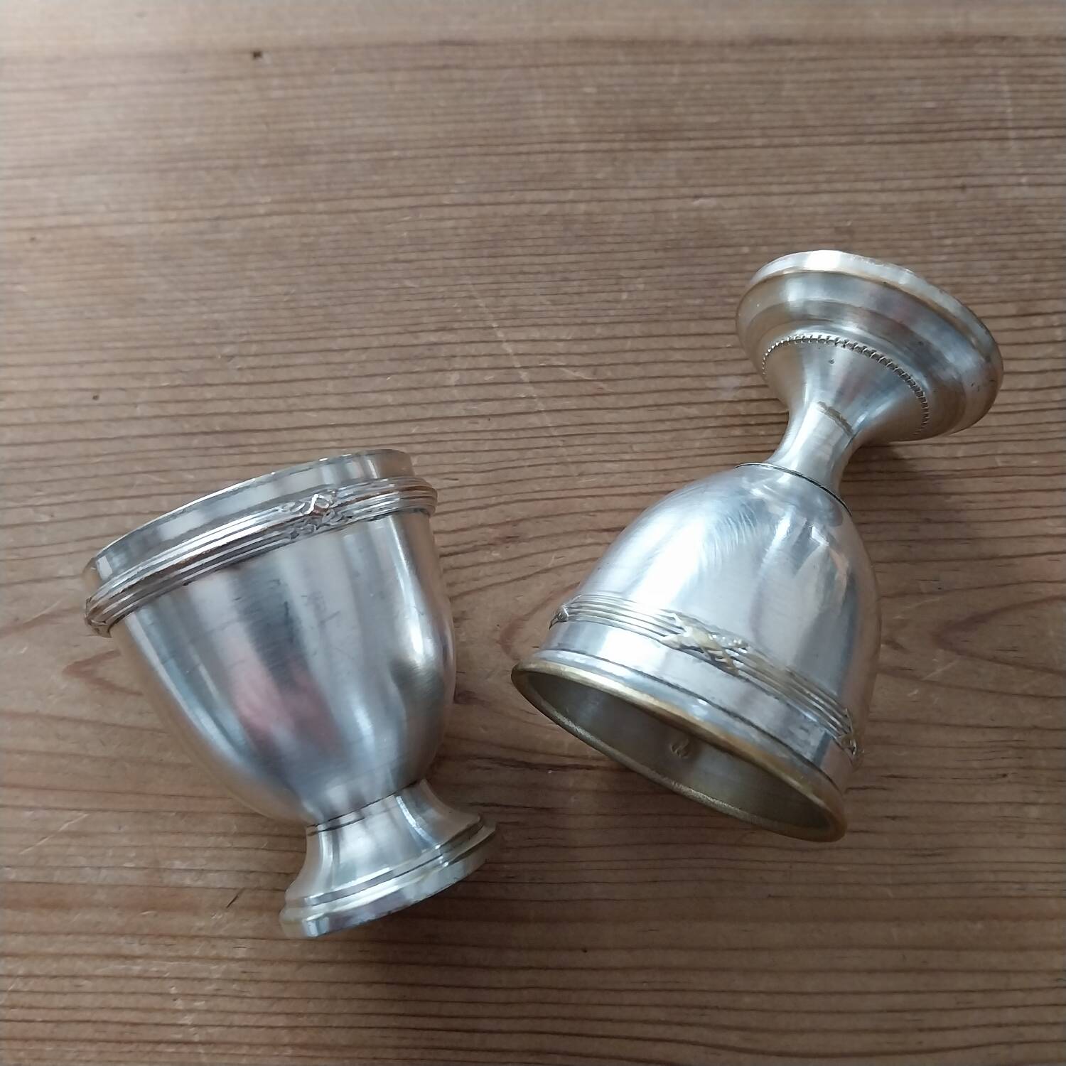 Antique egg cups on silver-plated metal stand
