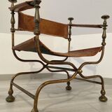 Curule leather armchair
