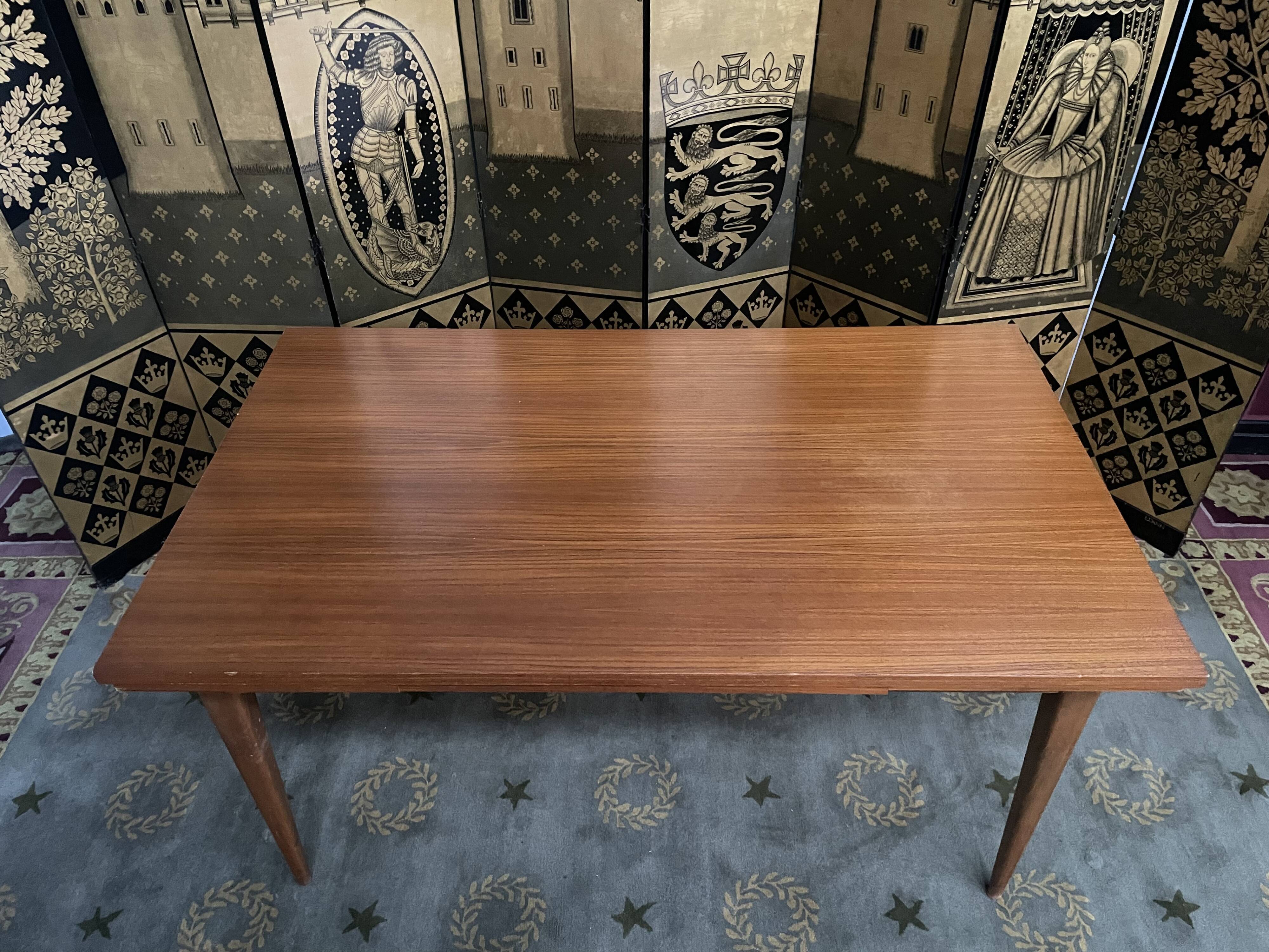 Scandinavian dining table with built-in extensions