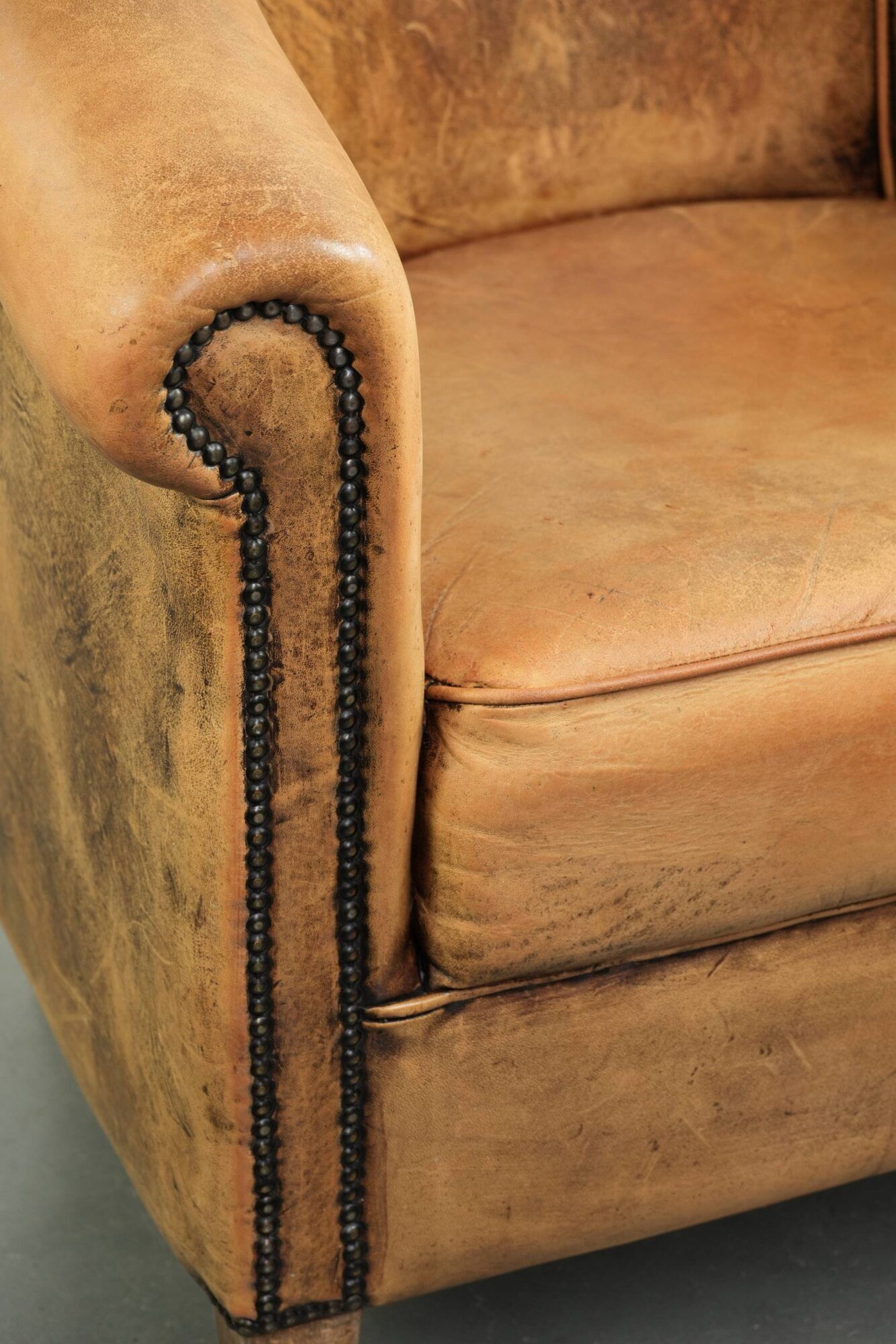 Vintage sheepskin club armchair in a light cognac colour