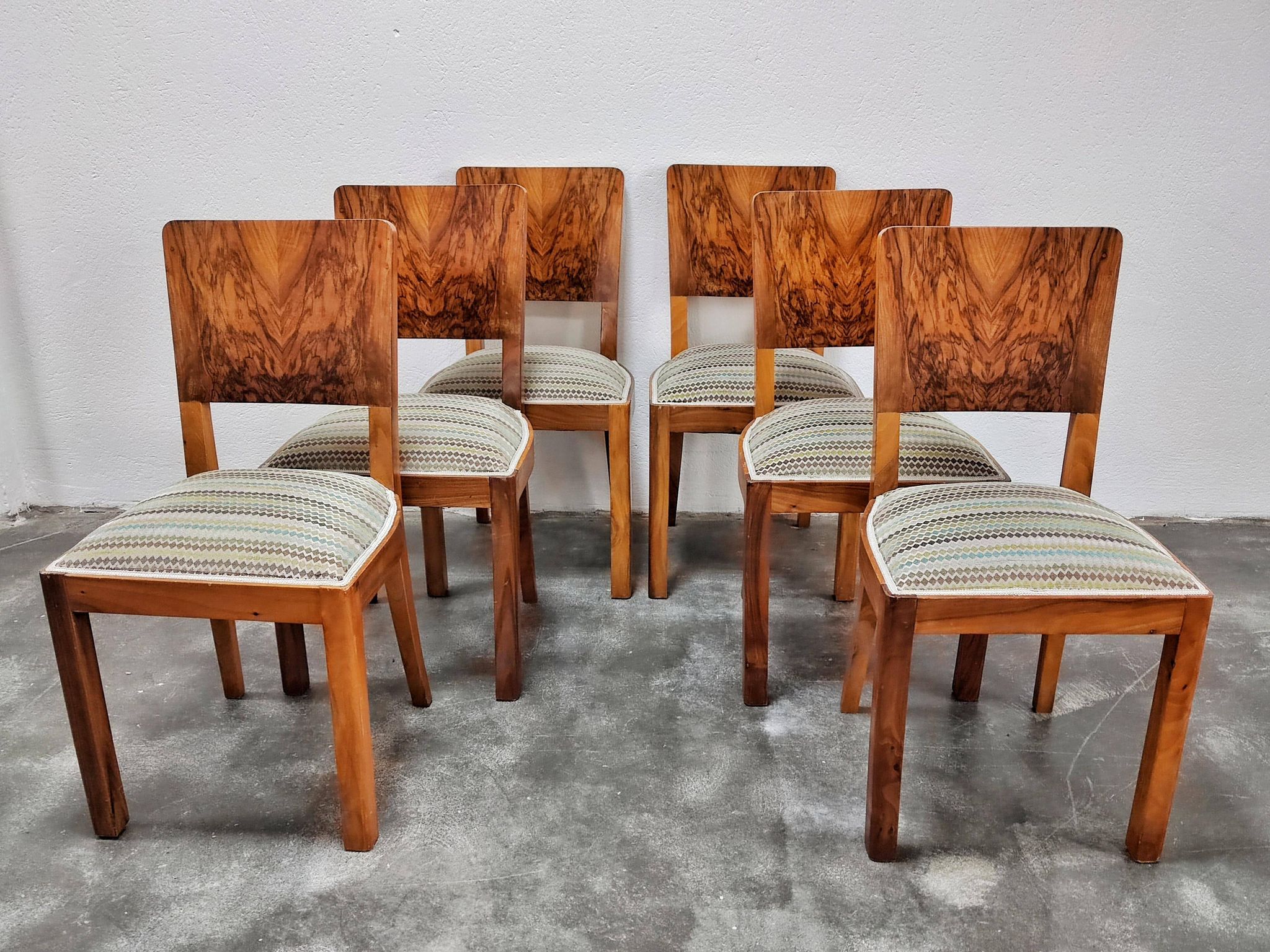 Set of six Art Deco dining chairs in walnut root veneer, 1940s.