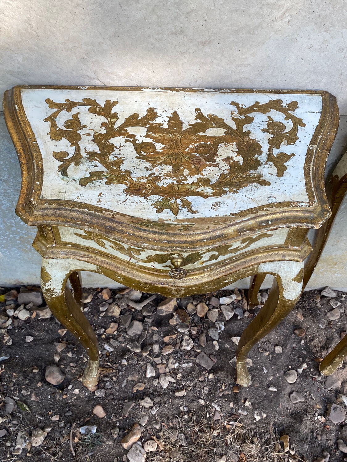 Pairs of Florentine bedside tables in gilded wood.