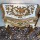 Pairs of Florentine bedside tables in gilded wood.