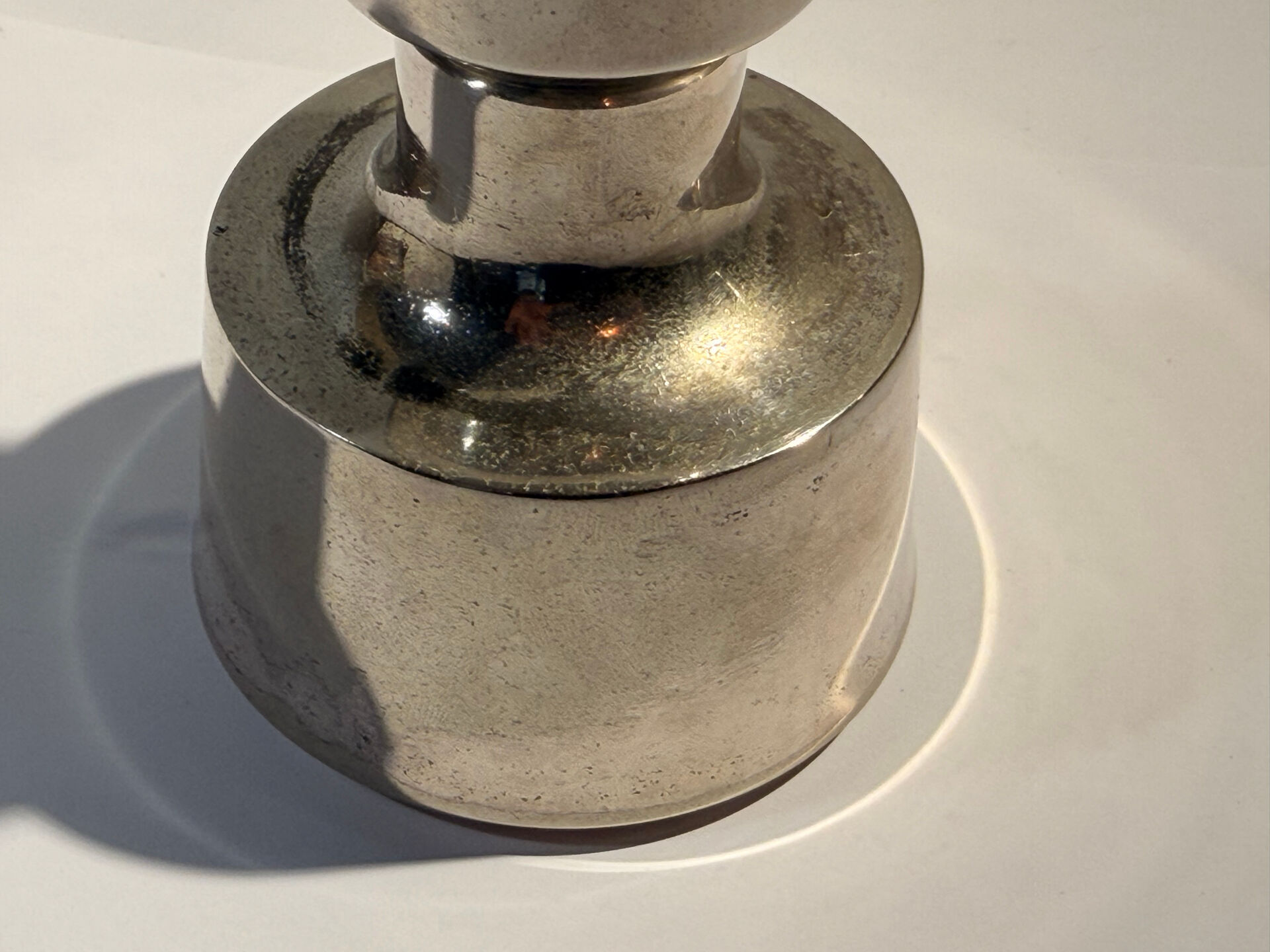 Metal candlestick by Jens Quistgaard for the brand Dansk Designs.