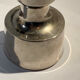 Metal candlestick by Jens Quistgaard for the brand Dansk Designs.